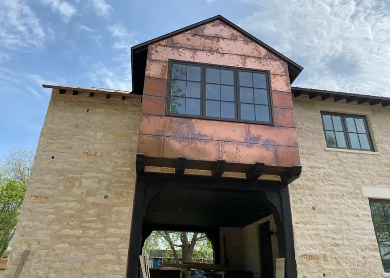 Copper metal panel facade on a stone building for Skylight Installation in Tullahoma